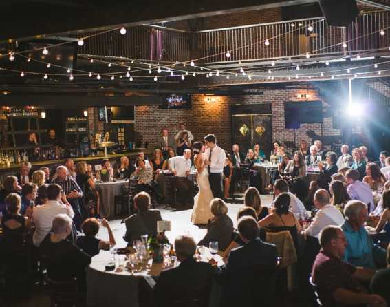 Newlyweds dancing at a wedding at Mile High Station in Denver, Colorado