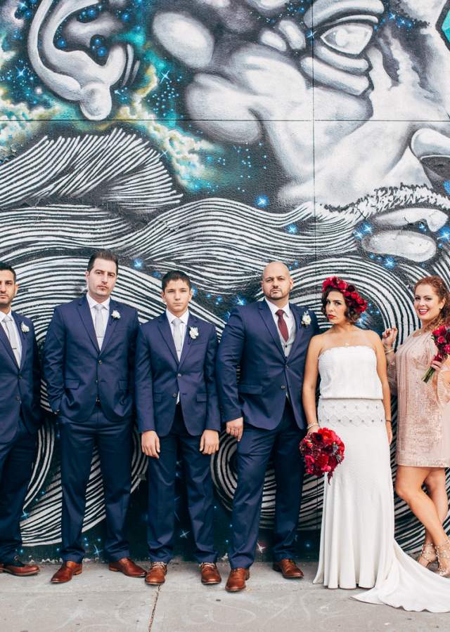 Wedding party in front of street art in Denver, Colorado