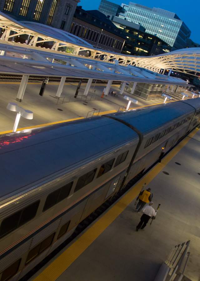 Two people boarding the ski train at Denver Union Station