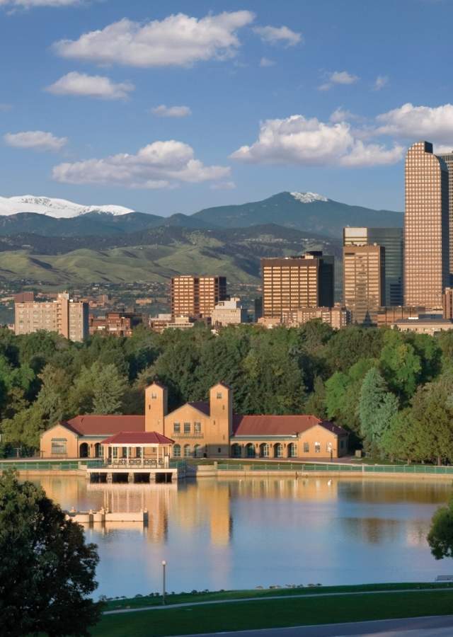 City Park Boathouse on the lake and Denver City Skyline